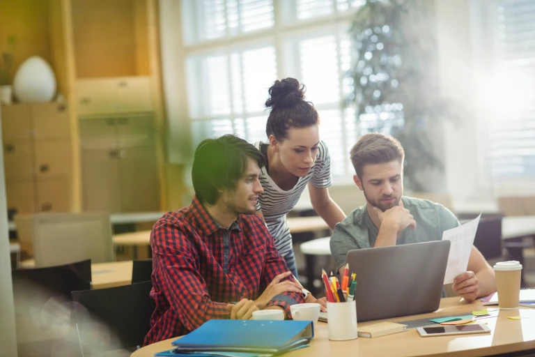 group business executives discussing laptop their des